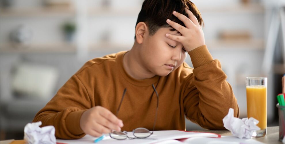 Child stressed studying for exam